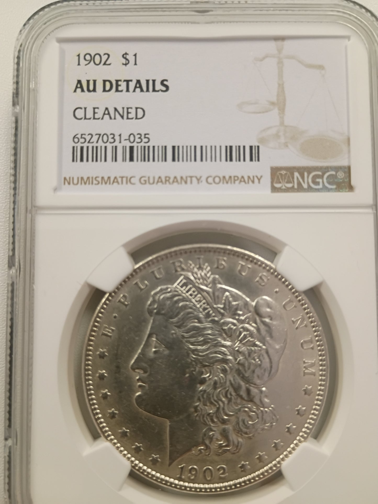 1902 Morgan Silver Dollar | NGC AU Details – Cleaned | Certified | Cert #6527031-035